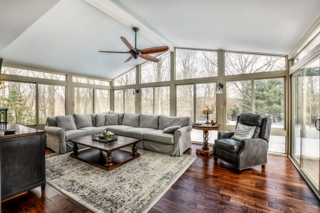 Interior of a fully furnished sunroom.