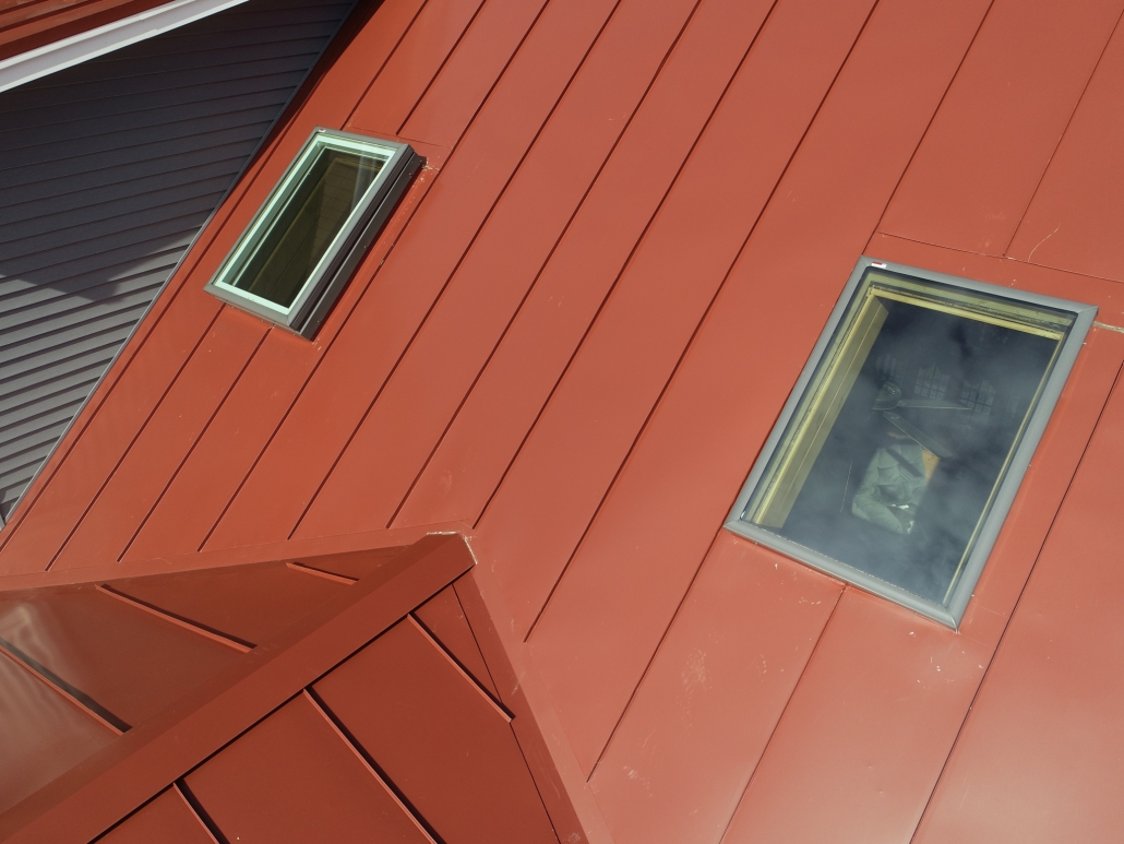 Skylights on a red metal roof