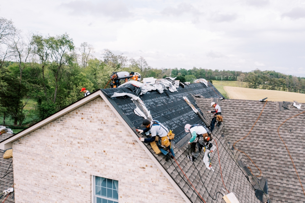 Valley Roofing roofers applying a new roof to a Waynesboro, Virginia house.