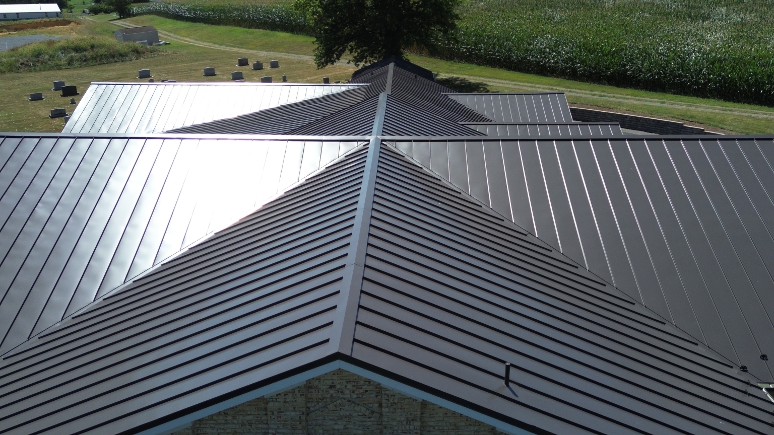 Drone photo of complex rooflines on new metal roof at Dayton Mennonite Church